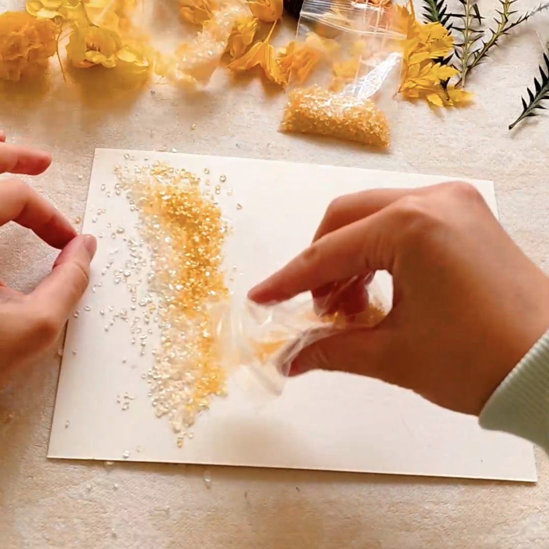 Glue & sprinkle the crystals