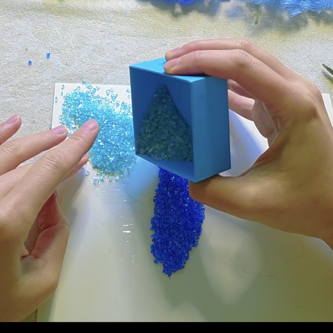 Glue & sprinkle the crystals
